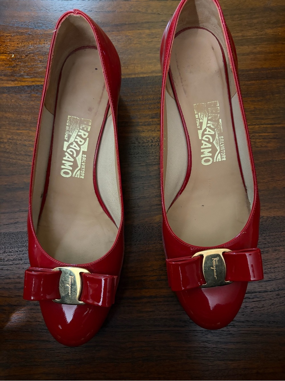 Salvatore Ferragamo Red Patent Leather Bow Pumps in size 7